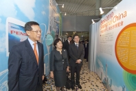 Mr Hui and the officiating guests tour inside the miniature Hong Kong pavilion.