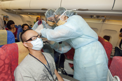 Medical staff assesses the health condition of the patient on board.