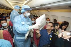 Medical staff accesses other passengers that might have come into close contact with the sick patient.