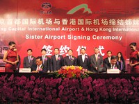(front left) Stanley Hui Hon-chung, Chief Executive Officer of AAHK, and (front right) Zhang Guanghui, Executive President of BCIA Co., Ltd., sign the MOU on the “sister airports” arrangement between the two airports. <br>(back row, fourth right to left) Dr Marvin Cheung, Chairman of AAHK; Li Jiaxiang, Administrator of CAAC; Dong Zhiyi, Executive President of CAH.
