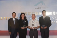 Mr Hui presents individual awards to May Leung, Chan Tak-wai and Taren Kwong (left to right) for their outstanding services.