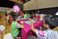 A group of approximately 80 primary students aged six to 12 years old take charge of the Hong Kong International Airport as part of a competition playing the new board game 