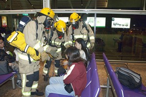The exercise simulates an aircraft with passengers crashing into a concourse, the first of its kind among the previous drills. More than 400 representatives from 30 government departments and organisations take part, and more than 300 volunteers from eight organisations and universities are recruited to play the roles of passengers and meeters and greeters.