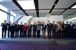 Guests toast for the official opening of the new SkyPier and North Satellite Concourse.