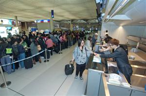 Designated queuing areas are set up to facilitate passenger flow and maintain terminal order during the drill.