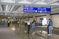 Port Health checks the body temperature of arrival passengers at Southwest Concourse and South Apron Passenger Vehicle entry gate